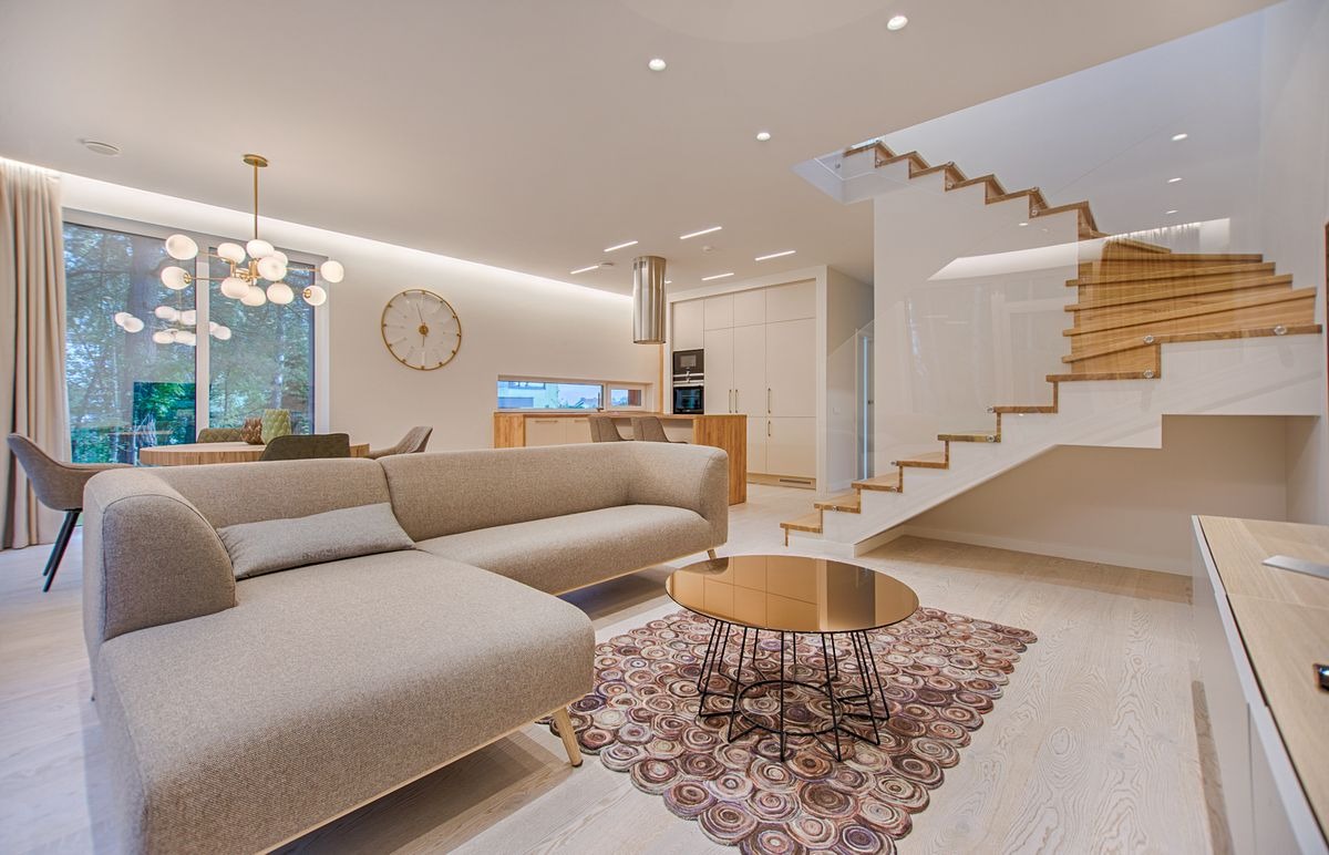 Open-concept home with recessed cans, cove lighting, and chandelier