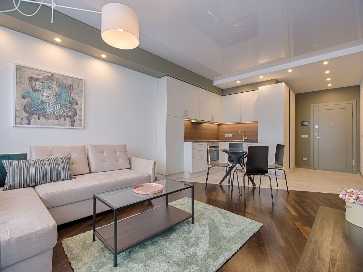 Recessed can lights installed across a living room ceiling